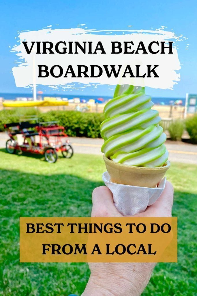 Someone holding an ice cream cone and looking out over the ocean along the Virginia Beach Boardwalk.
