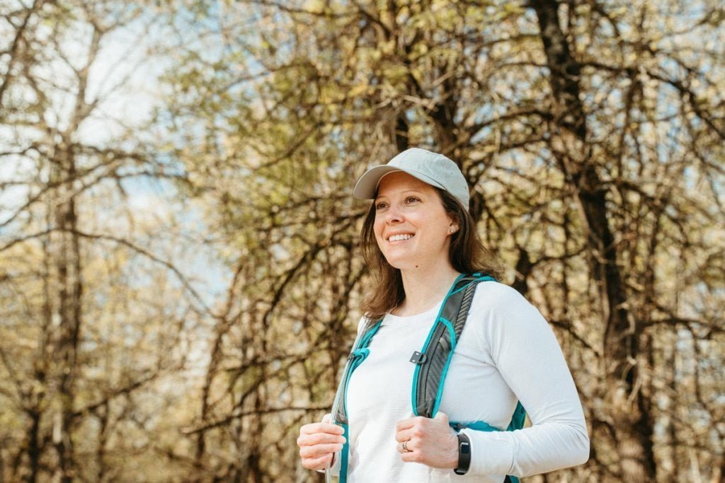 Woman hiking and smiling