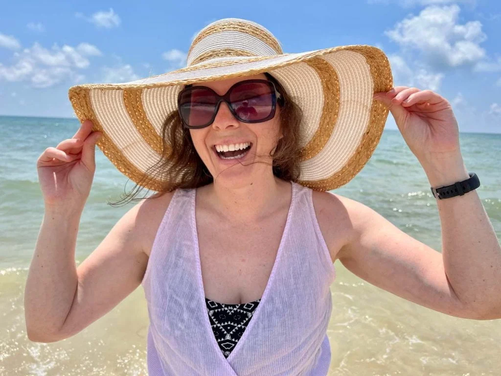 things-to-do-in-apalachicola-fl Happy lady at the beach near Apalachicola, Florida