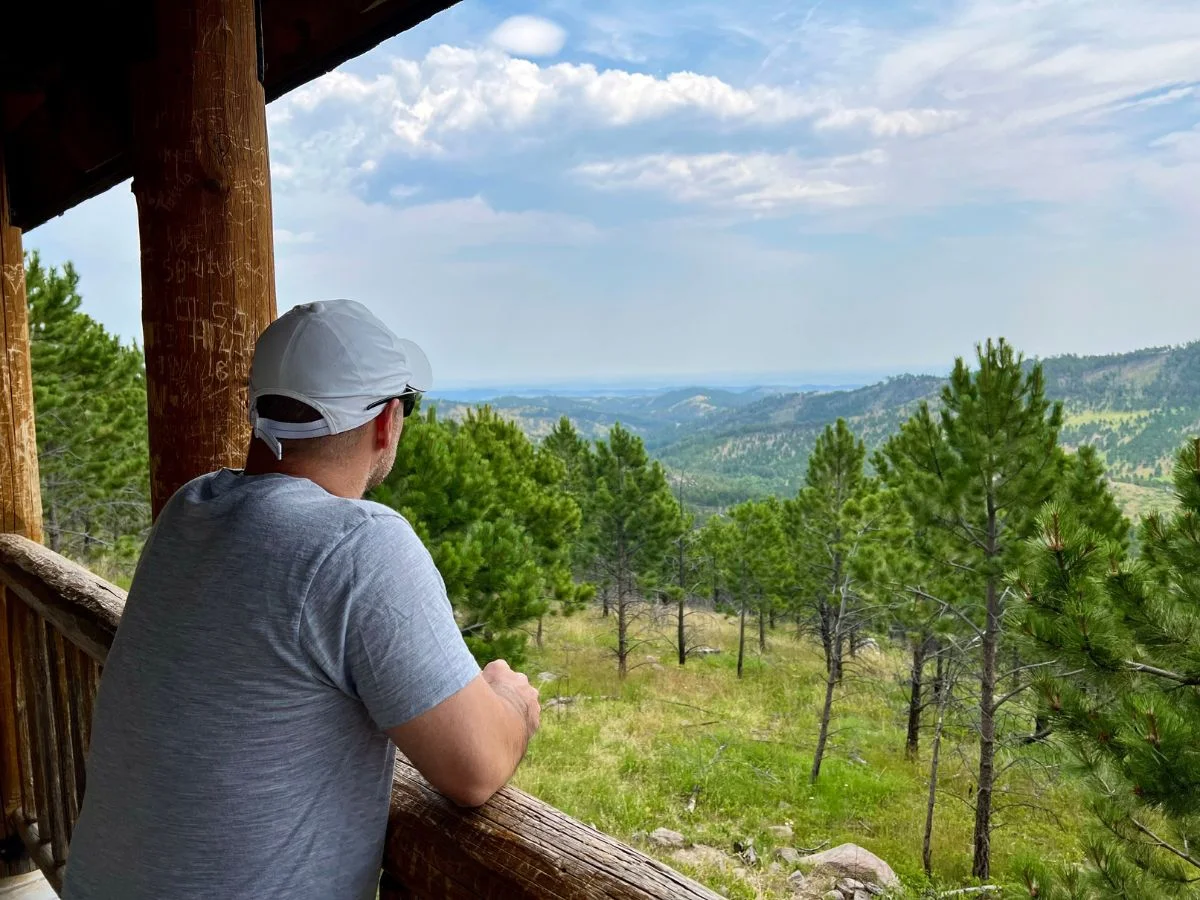 Pablo overlooking the Black Hills at a lookout in Custer State Park.
