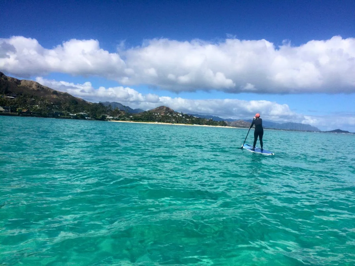 Ashlee paddle boarding in Oahu
